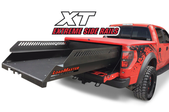 Red ford raptor with a loadmaster xt cargo slide with high side railing